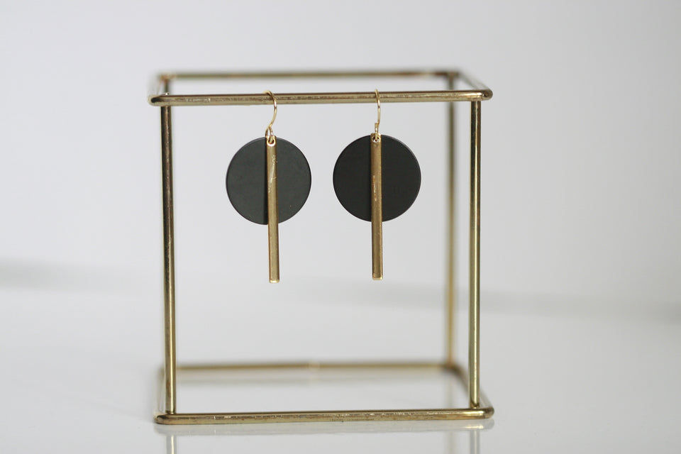 These geometric black and brass gold statement earrings make a big statement, yet are still so easy to wear. Unsurprisingly, gold symbolises wealth and prosperity. Black signifies powerfulness and sophistication. Earring hoop is gold plated. Designed and handcrafted in Ireland.