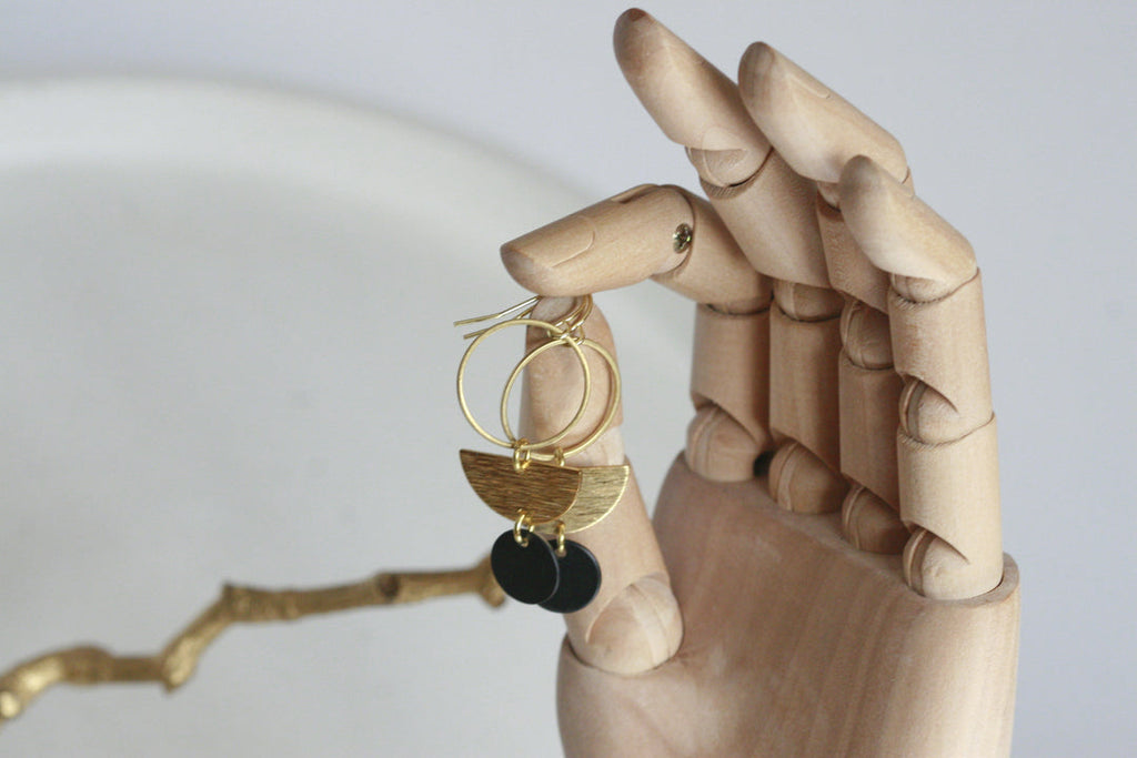 These geometric beauties make a big statement, yet are still so easy to wear. Brass charm with gold plated earring hoop.