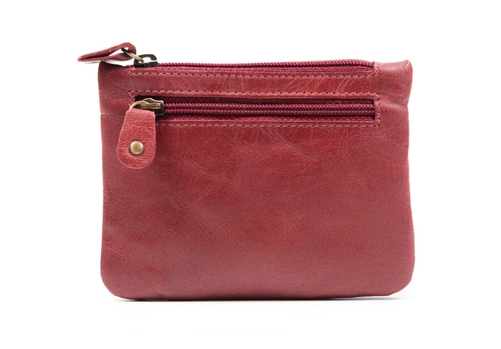 This purse features three zippered pockets with velvety lining. The top pocket is perfect for credit cards, while the front and rear pockets can hold cash and coins. The soft leather purse is versatile and easy to use. Crafted from durable and lightweight Oily Water Buffalo leather, it improves with age and use.&nbsp;